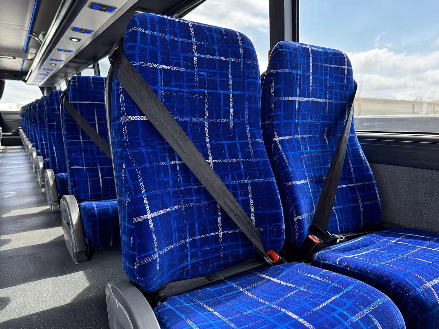 how the time of year and peak seasons affect norman charter bus rental rates